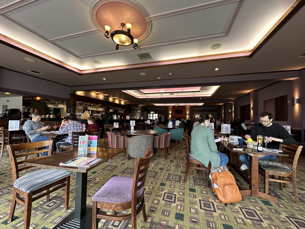 The interior of The Dockle Farmhouse in Swindon is huge, with a massive room at one end decorated with Wetherspoon's trademark carpet.