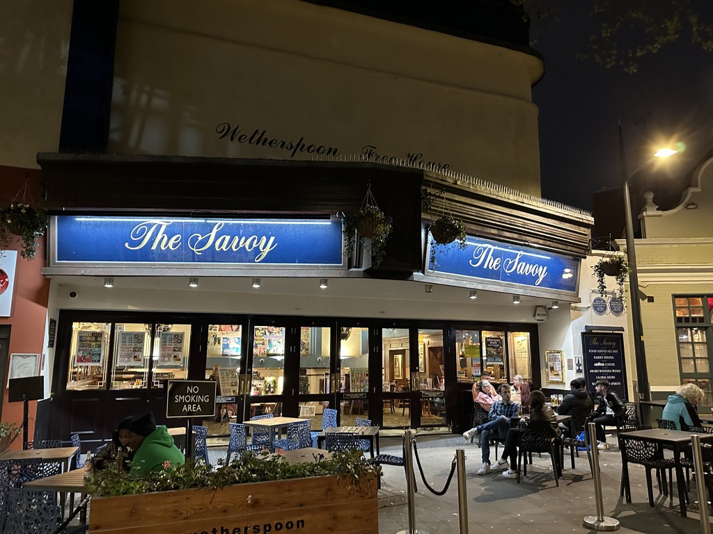 The exterior of The Savoy has retained its old cinema charm and the seating area makes the pub look open and inviting.