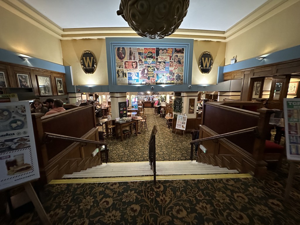 The interior is large with steps leading down to the sunken bar area.